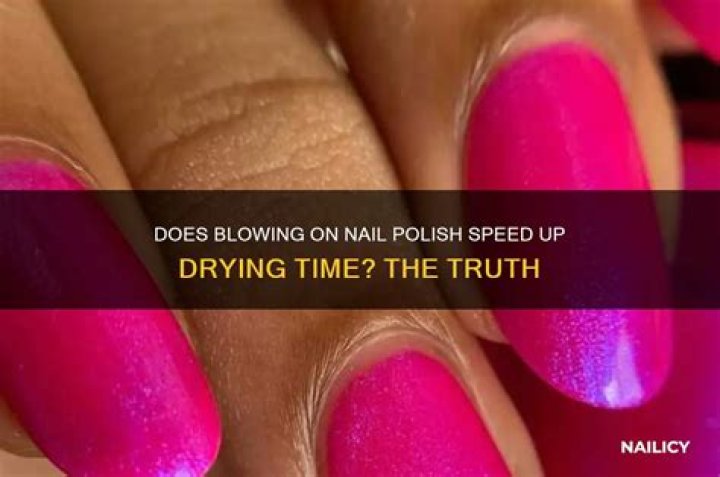 Does blowing on nail polish help it dry?