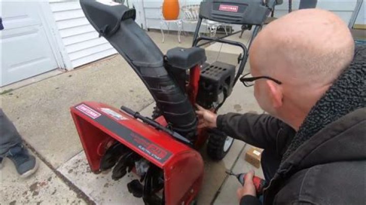 How do I adjust the carburetor on my snowblower?