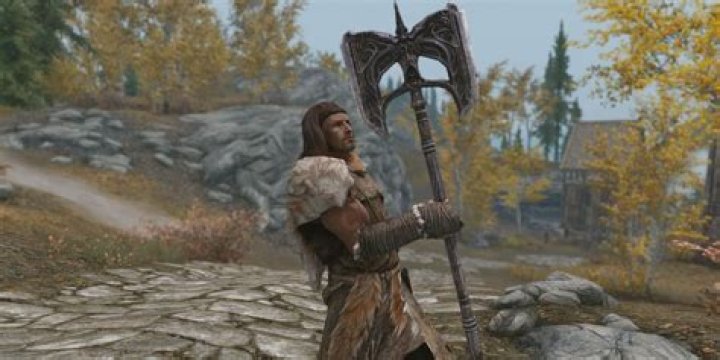 How do you block with two-handed weapons in Skyrim?
