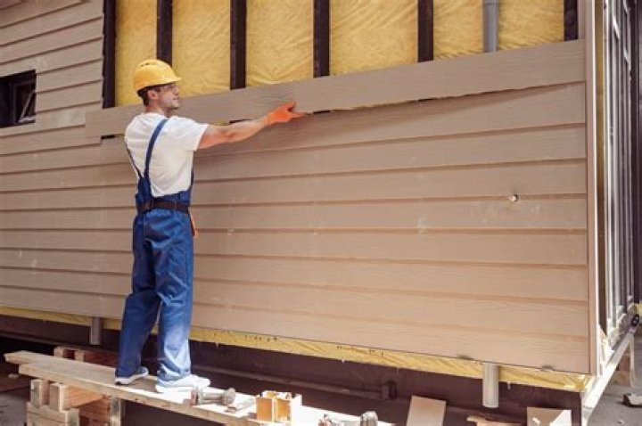 Should I caulk bottom of lap siding?